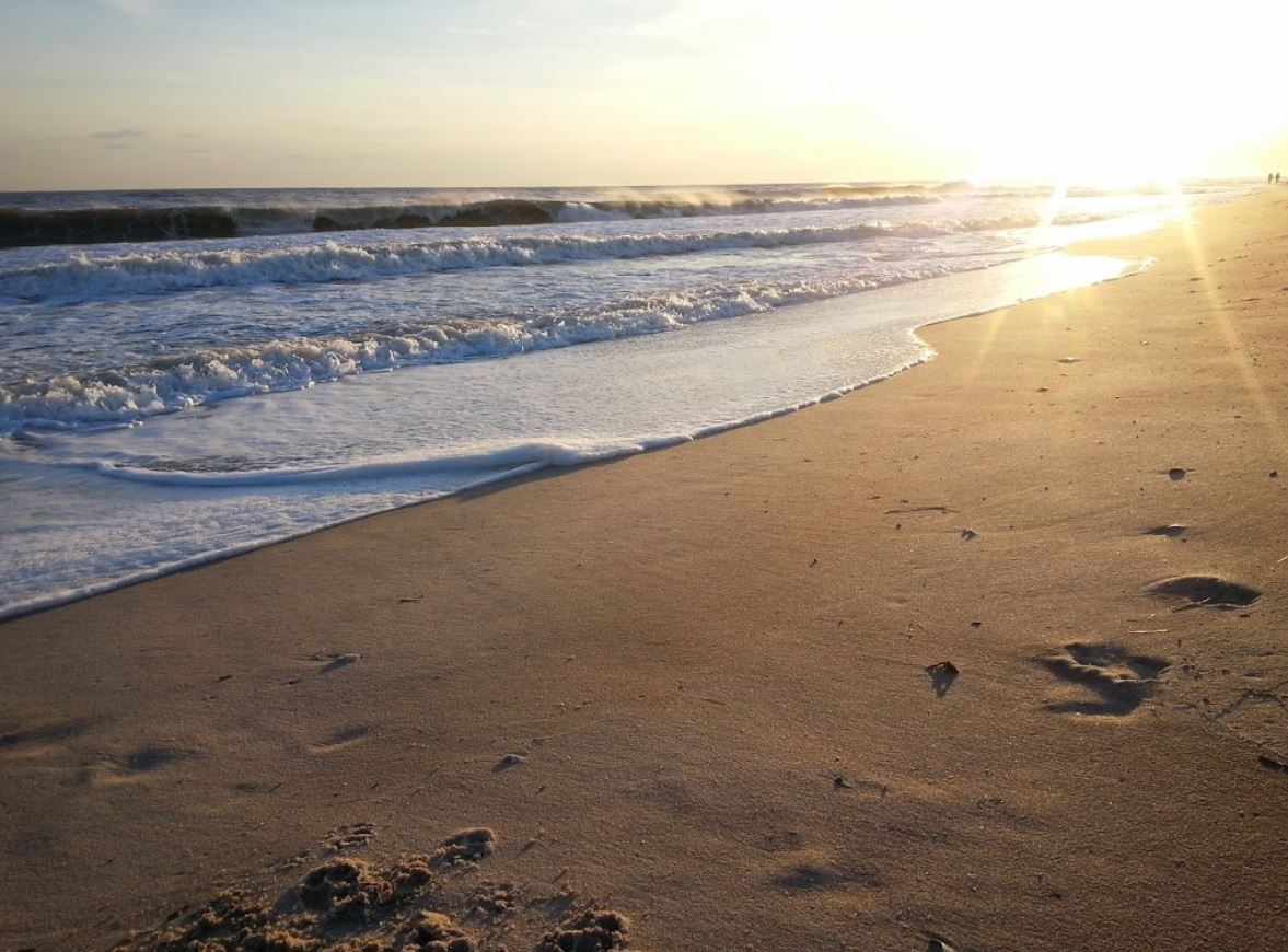 Coopers Beach along the Atlantic shoreline with historic mansion views in Southampton, NY