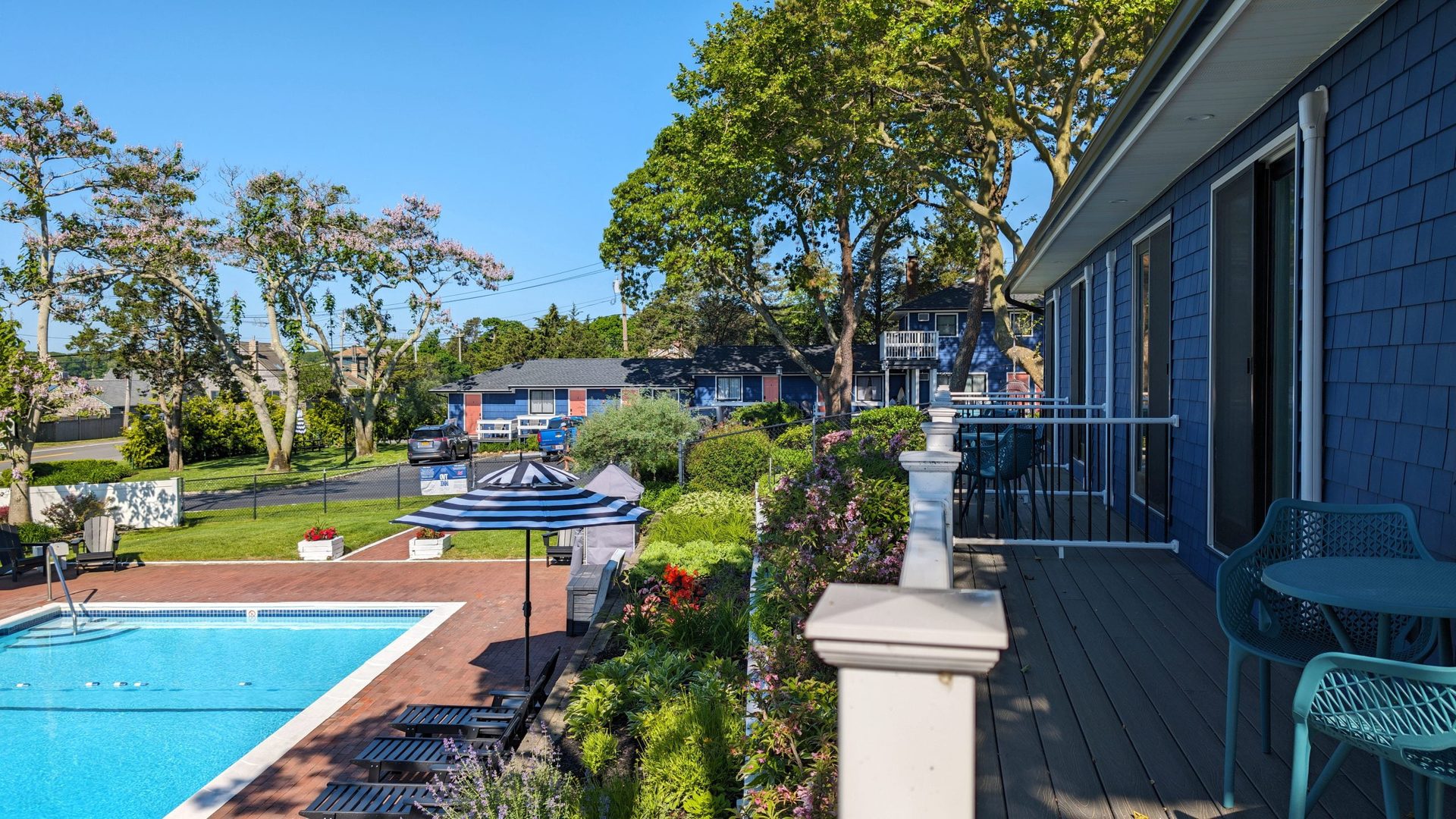 Garden area at Ocean View Terrace Inn with Adirondack chairs